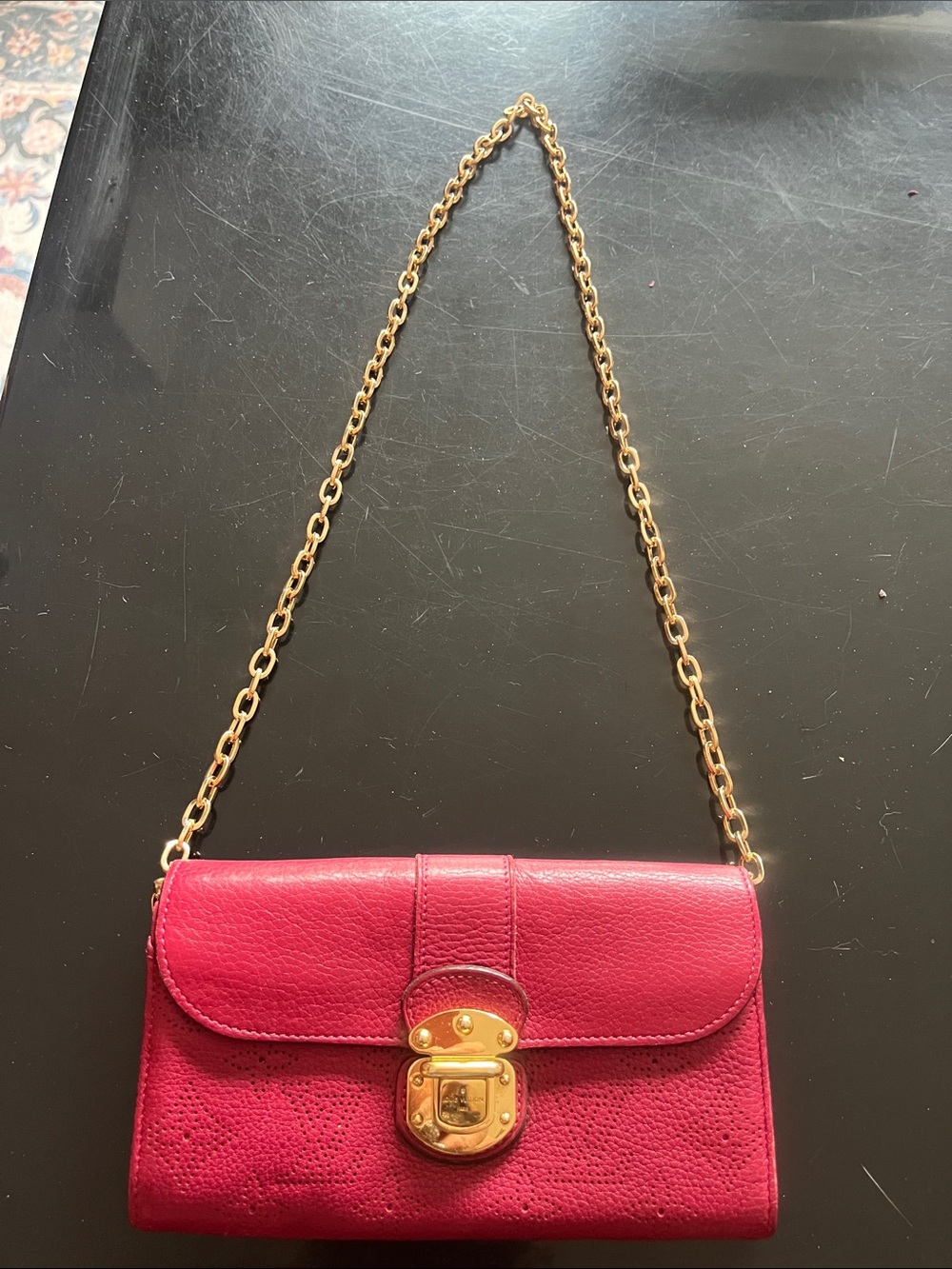 Louis Vuitton Grenat Monogram Mahina Leather wallet on unbranded chain
